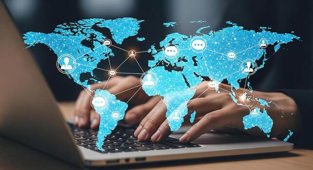 Person using laptop computer to connect with global network symbolizing international communication and collaboration A digital world map with communication icons overlays the hands typing representin photo