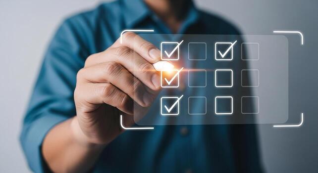 Person checking items off a digital checklist completing tasks and achieving goals in a modern workspace representing productivity and success photo