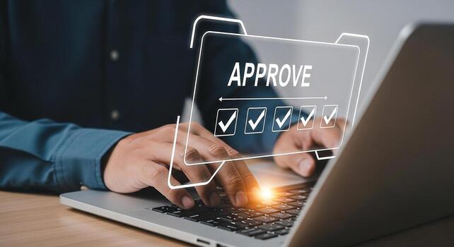Person Approving a Project on Laptop Checkmarks and Approve Word on Screen Office Desk Setting Concept of Successful Business Workflow and Project Management photo