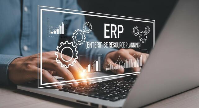 Businessman using laptop computer to implement ERP system, improving efficiency and productivity in the modern workplace He is working diligently on enterprise resource planning, analyzing graphs and photo