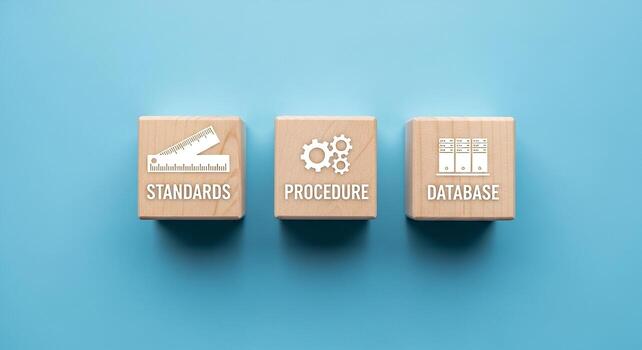 Wooden blocks with standards, procedure, and database icons on a blue background, symbolizing essential business compliance and data management photo