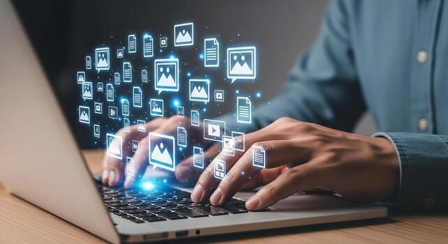 Person working on laptop computer, managing digital media content, in a modern office, showcasing efficient workflow and technology integration photo