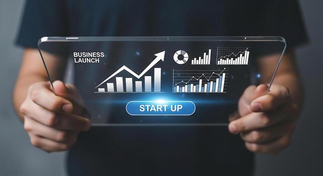 Man launching a business startup, holding a transparent tablet displaying growth charts and graphs, symbolizing success and innovation photo