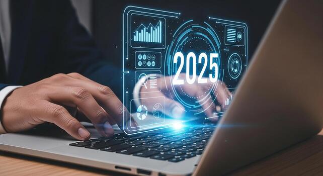 Businessman using laptop computer analyzing futuristic digital interface showing 2025 year projection planning future strategy innovative technology concept photo