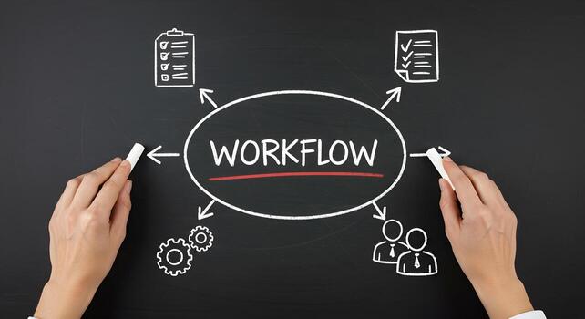 Hands drawing workflow diagram on blackboard illustrating business process teamwork and planning The visual depicts strategic planning process optimization and efficient task management highlighting t photo