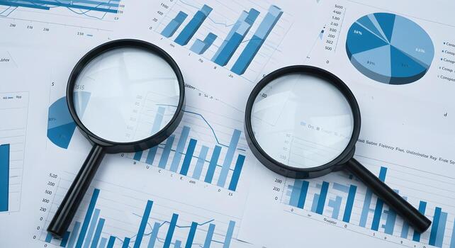 Two magnifying glasses analyzing detailed financial charts and graphs revealing key insights and business performance data for strategic decisionmaking The image evokes a sense of meticulous examinati photo