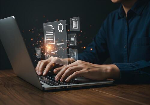 Person working on laptop with digital document interface managing files and data in a dark modern office showcasing efficient workflow and digital transformation concept photo