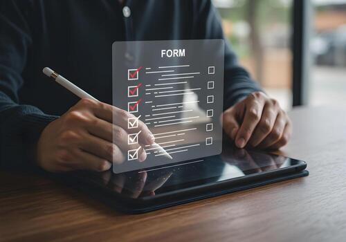 Person completing an online form using a stylus on a digital tablet efficiently managing tasks and achieving goals in a modern workspace photo