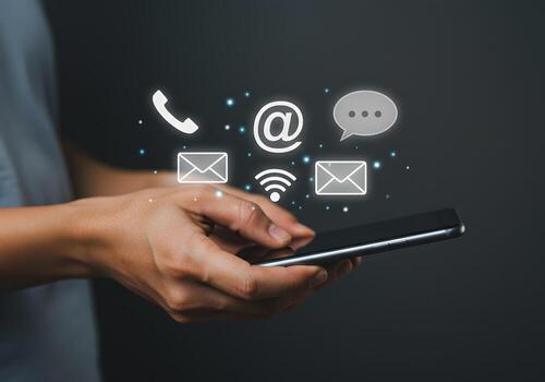 Person using smartphone connecting through email phone and message apps representing modern digital communication and global connectivity photo