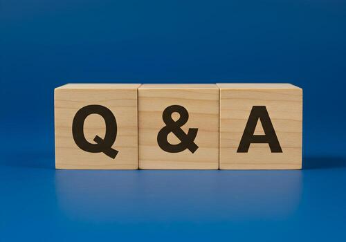 Wooden Blocks Spelling QA on Blue Background Questions and Answers Concept for FAQ Help Support and Communication photo