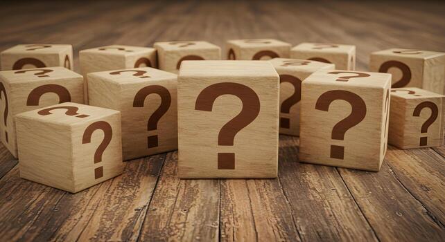Wooden cubes with question marks on a rustic wooden surface symbolizing uncertainty questions and the search for answers The image evokes a sense of mystery and intrigue perfect for concepts related t photo