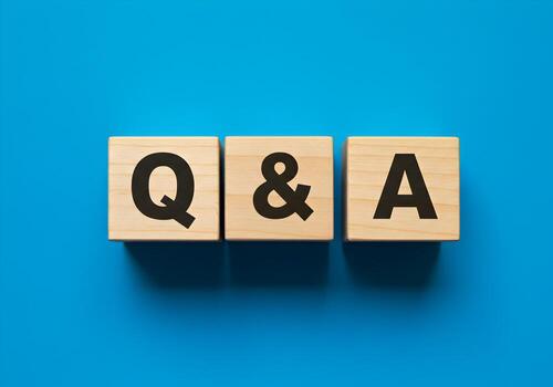 Wooden Blocks Spelling QA on a Blue Background Questions and Answers Concept for FAQ Support photo