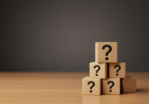 Wooden Cubes with Question Marks Forming a Pyramid on a Desk Representing Uncertainty and Questioning with a Dark Background and a Concept of Problem Solving and Curiosity photo