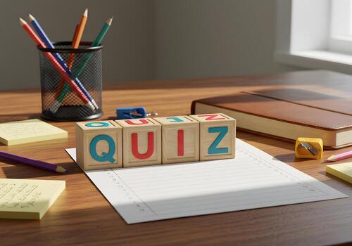 Wooden blocks spelling QUIZ on a desk with pencils notepad and book - concept of education testing and assessment photo
