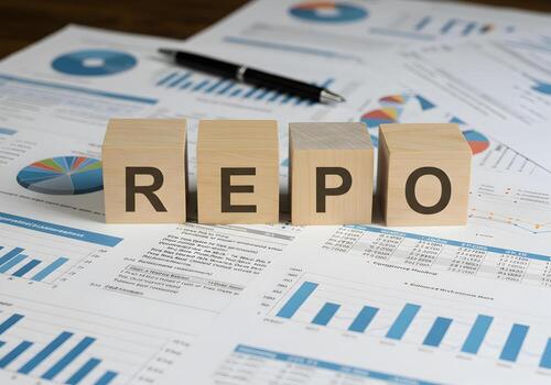 REPO - Wooden Blocks Spelling Repo on Financial Documents Charts and Graphs - Business Finance and Banking Concept photo