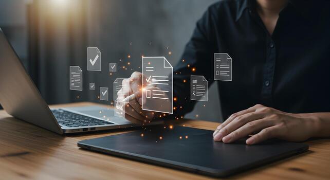 Person reviewing and approving digital documents using a stylus on a graphics tablet at a modern workspace signifying efficient workflow and successful project completion photo