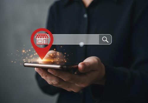 Person using smartphone to search for local business via online map app finding nearby stores and shops with GPS location search concept of online shopping and local store discovery photo