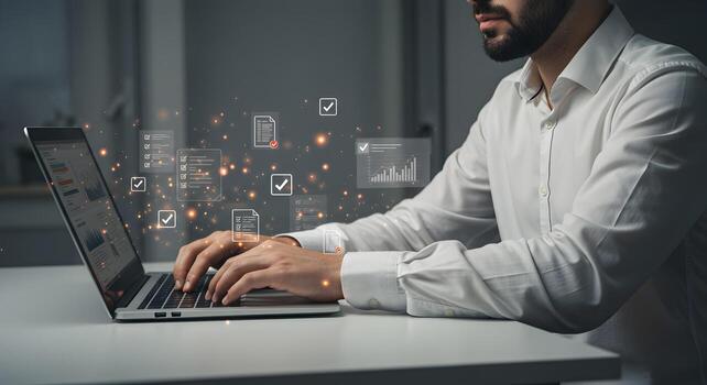 Man working diligently on laptop checking data and reports in a modern office symbolizing efficiency and success photo