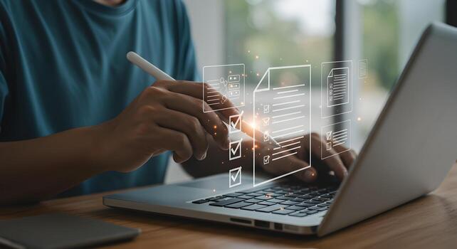 Person working on a laptop computer checking tasks on a digital checklist interface at modern workplace concept of productivity and efficiency photo