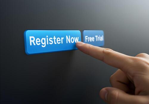 Finger about to press Register Now button next to Free Trial button on dark background Concept of online registration account creation and software subscription photo