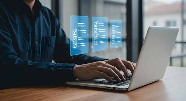 Person working on a laptop computer in a modern office diligently completing tasks on a digital checklist illustrating productivity and efficiency in the workplace photo