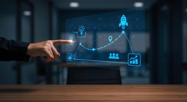 Hand pointing at a futuristic holographic display showing a business growth process with icons of idea location team and a rocket launching symbolizing innovation and success in a modern office settin photo
