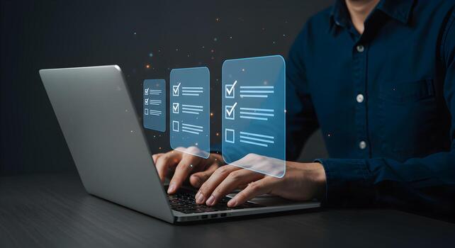 Person working diligently on a laptop completing tasks on digital checklists in a modern office setting achieving goals and productivity photo