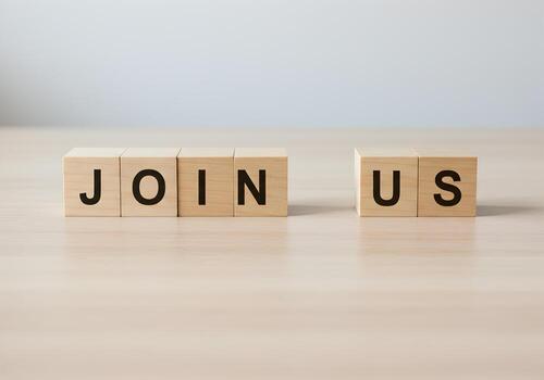 Wooden blocks spelling Join Us on a table signifying an invitation to join a team or community representing togetherness and collaboration This image is ideal for concepts related to teamwork recruitm photo