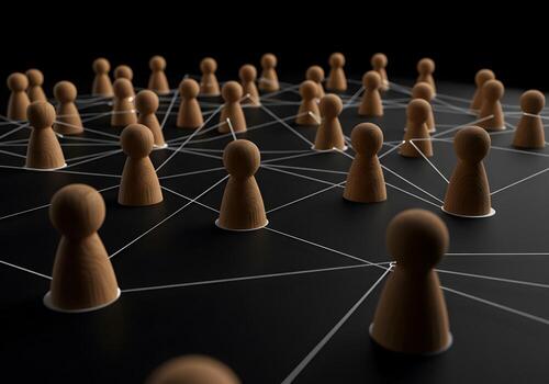 Wooden figures interconnected by lines on a dark surface symbolizing network connection communication and global community The image represents collaboration teamwork and the concept of a global netwo photo