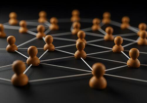 Wooden figures interconnected by strings on a dark background symbolizing a network connection and collaboration This image represents global communication teamwork and the power of social networking photo