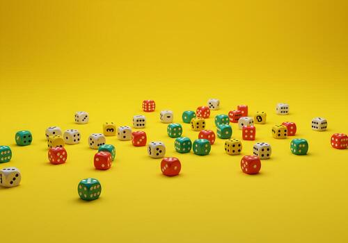 Colorful Dice Scattered on Vibrant Yellow Background A Playful Image Representing Chance Luck and Randomness photo