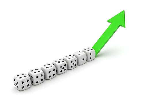 White dice with black dots rising with a green arrow symbolizing growth progress and upward trend in business finance or gambling The image depicts a sequence of dice leading to an upwardpointing arro photo