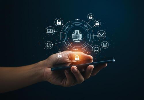 Hand holding smartphone with digital fingerprint and security icons illustrating secure mobile access and data protection in a modern technological environment The image evokes a sense of safety priva photo