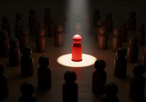 Red Figurine Stands Out Illuminated by a Spotlight in a Dark Room Representing Leadership Uniqueness and Standing Out from the Crowd The image is ideal for illustrating concepts related to success rec photo