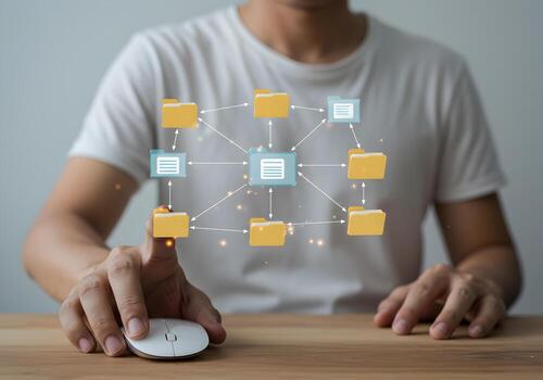 Man using wireless computer mouse to manage and organize digital files and folders in a network system concept of data management and cloud computing photo