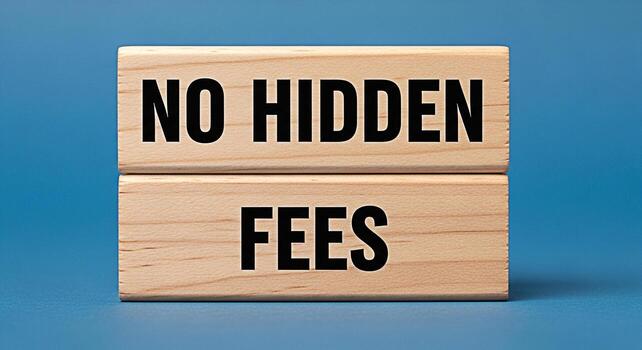 Wooden blocks displaying the message no hidden fees on a blue background representing transparency photo