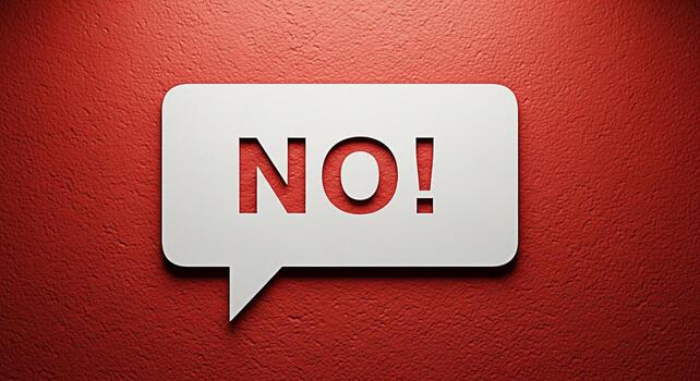 White speech bubble with the word no on a textured red wall representing denial and disagreement photo