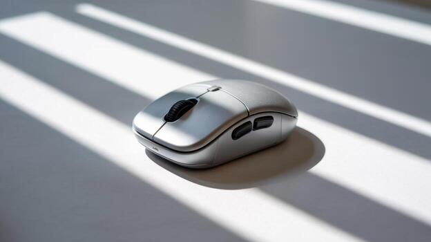 Wireless computer mouse ergonomic design for pc laptop silver mouse with shadow on white surface photo