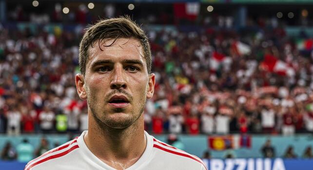 intenso retrato de un fútbol jugador, capturado durante un En Vivo partido con aficionados en el antecedentes. foto