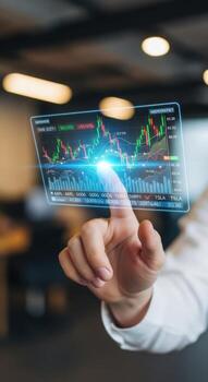 A person interacts with a stock market chart on a transparent digital display screen device photo
