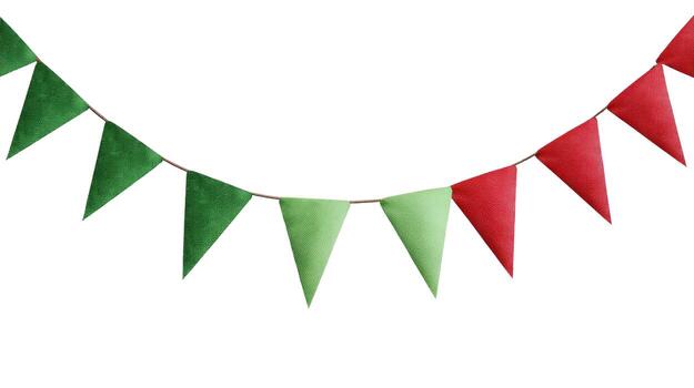 Festive garland with alternating green and red triangular flags hanging on a thin string isolated photo