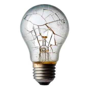 Close up of a broken light bulb with visible cracks and filament on a plain white background studio shot photo