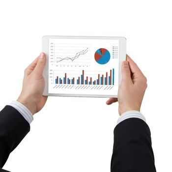 Person holding tablet displaying charts and graphs in business setting with suit jacket on arms photo