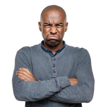 Man with arms crossed displaying a displeased expression on a plain white studio backdrop image capture photo