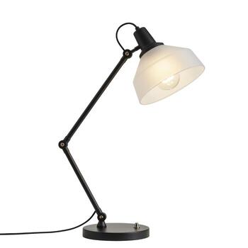 A black adjustable desk lamp with a white lampshade sitting on a white surface in a studio setting photo