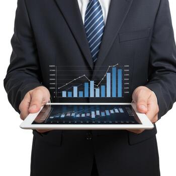 A man in a suit holding a tablet displaying business graphs and charts for financial analysis data photo