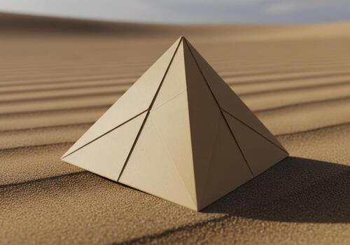 A small cardboard pyramid stands majestically in the desert sand under a soft sky. Origami Design photo