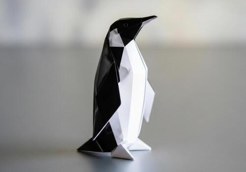 Modern geometric penguin sculpture standing tall and proud on a smooth surface captivating design Origami Design photo