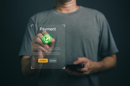 Close up Hand Man Using Smartphone to Complete Online Payment with Secure Payment Confirmation and Cancellation Options in Dark Background photo
