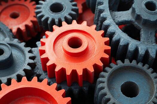 Red cog amidst gritty blue gears, symbolizing Innovation Days dynamic synergy, a mechanical ballet of precision and progress photo